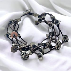 Fossil multi cord bracelet with silver flowers and discs
